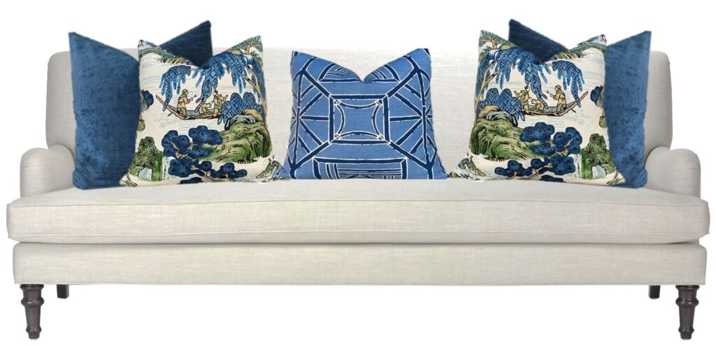 image of a cream sofa with blue accent pillows and a patterned blue pillow and two featured blue and white pillows with an Asian pattern