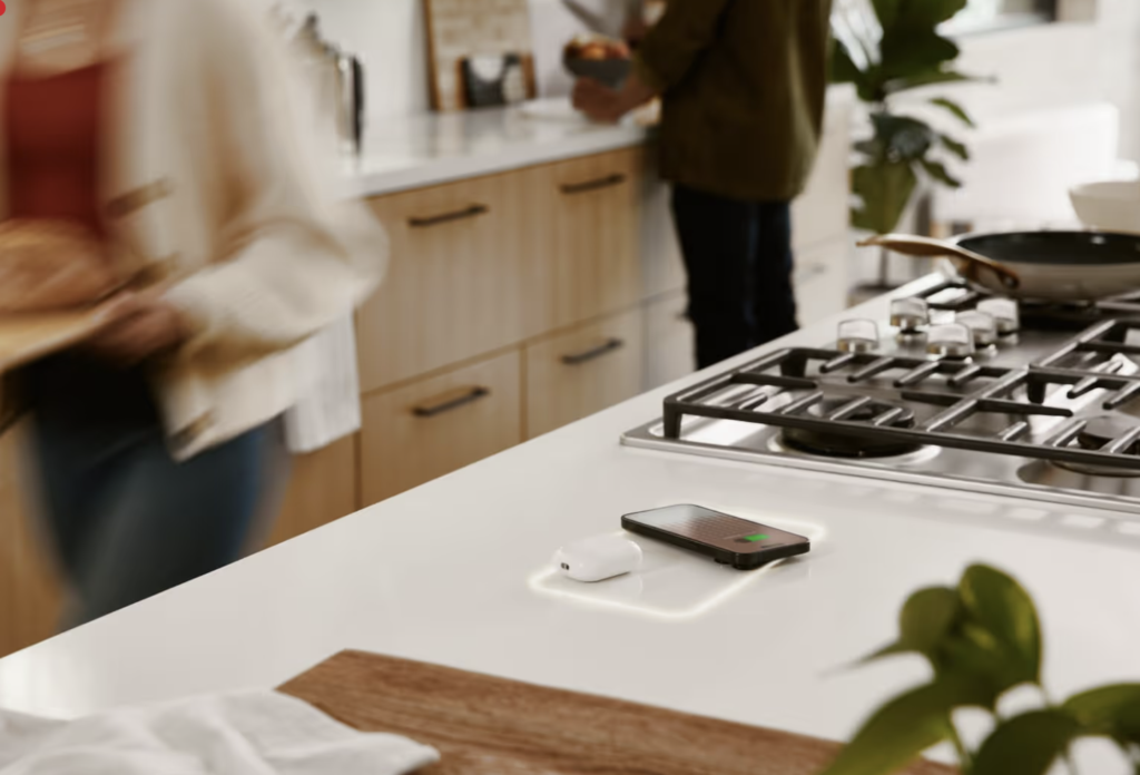 a section of a countertop next to the cooktop with embedded charging station in the countertop